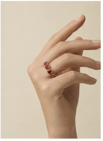 Seraphine Ruby Trilogy Ring styled on a model from a second angle